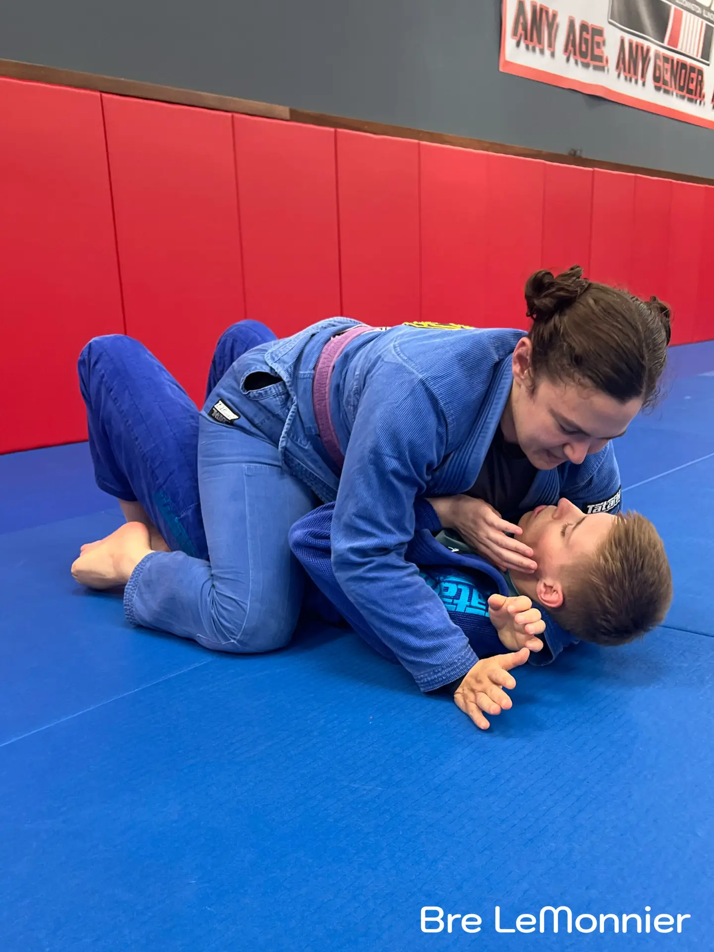 Adults practicing Brazilian Jiu Jitsu at Frequency Martial Arts in Bloomington, IL, improving fitness, self-defense, and confidence.