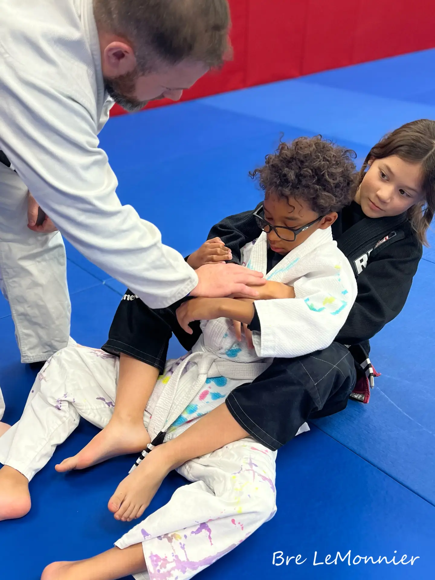 Children practicing Brazilian Jiu Jitsu at Frequency Martial Arts in Bloomington, IL, learning discipline, confidence, and self-defense.