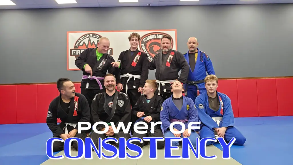 Adults practicing Brazilian Jiu Jitsu at Frequency Martial Arts in Bloomington, IL, improving fitness, self-defense, and confidence.